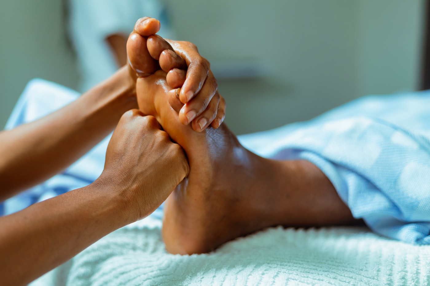 Foot massage in warm light